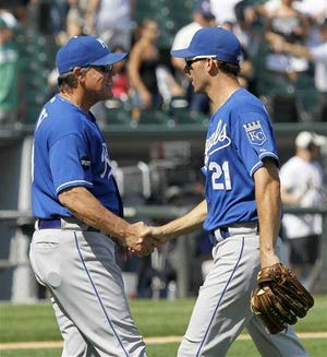 Kansas City Royals manager Ned Yost, left, congratulates right fielder Jeff Francoeur after the Royals' 4-1 win over the Chicago White Sox earlier this week. The Royals manager believes his team is playing well enough lately that the near-miss losses can easily become victories.