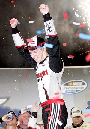 Brad Keselowski celebrates after winning the NASCAR Nationwide Series auto race Friday at the Kentucky Speedway in Sparta, Ky. 
AP Photo