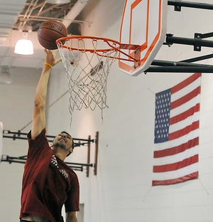 Tony Gaffney makes a shot at the basketball camp at Berkley Middle School.