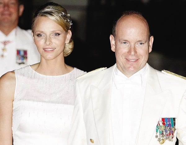 Lionel Cironneau/The Associated Press
 In this July 2 photo, Charlene, princess of Monaco, and Prince Albert II arrive for the official dinner after their wedding. Princess Charlene wears a bold, asymmetrical tiara in diamond and white gold that symbolizes the one-time Olympic swimmer's love for the sea.