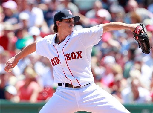 Red Sox pitcher Kyle Weiland, making his major-league debut, delivers in the first inning of yesterday's game against the Baltimore Orioles at Fenway Park. Weiland was thrown out of the game in the fifth inning after hitting a batter.