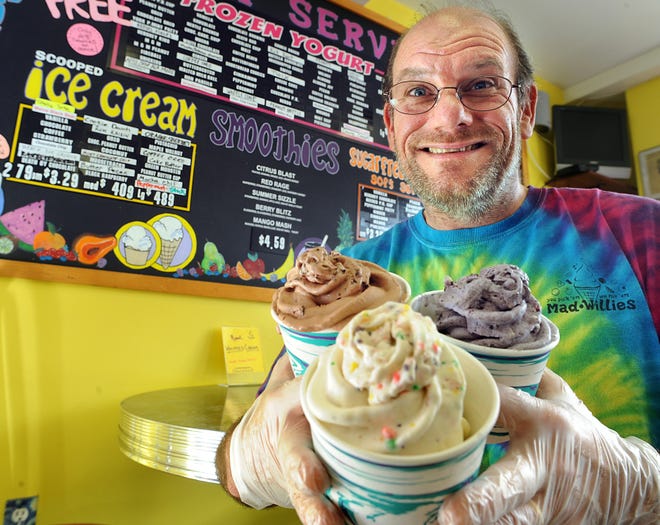 Greg Varney, owner of Mad Willies Ice Cream in Framingham, with strawberry Pop Rocks and Nerds, vanilla with blueberries, cheesecake and Oreos; and chocolate with orange cream, Nutella and chocolate chips