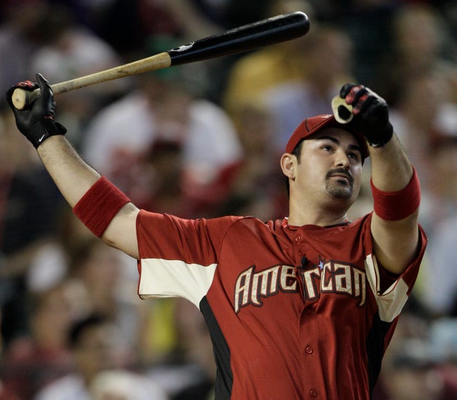 American League's Adrian Gonzalez of the Boston Red Sox watches his hit during Monday's MLB Home Run Derby in Phoenix.