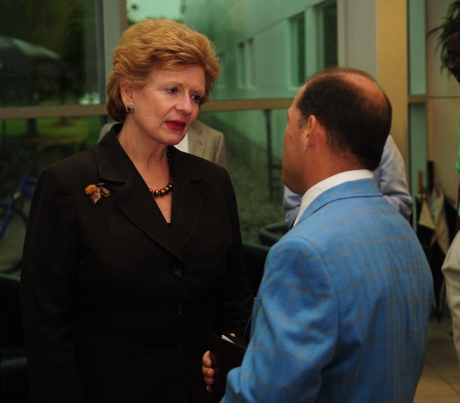 Trans-Matic President Patrick Thompson welcomes Sen. Debbie Stabenow during a press conference Monday morning. Dennis R.J. Geppert/Sentinel Staff