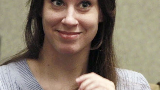 Casey Anthony smiles before the start of her sentencing hearing in Orlando July 7, 2011.