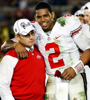 Ohio State head coach Jim Tressel (left) and MVP Terrelle Pryor celebrate after winning the Rose Bowl against Oregon in January 2010. Records now show that Tressel was told by the school that he did a poor job of self-reporting NCAA violations years before he failed to tell his bosses that players were selling championship rings and other Buckeyes memorabilia, a cover-up that cost him his job.