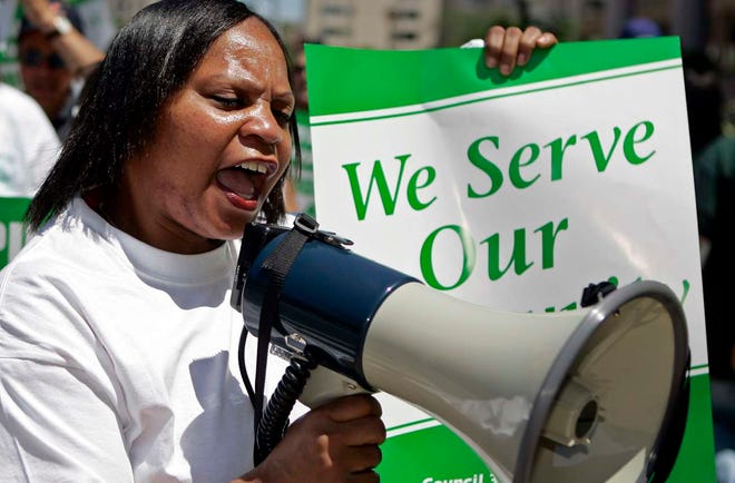 SCOTT MORGAN | ROCKFORD REGISTER STAR
Laverne Huggins leads chants as AFSCME union members picket during a demonstration for collective bargaining and honoring their contract Tuesday, July 12, 2011, at the Zeke Giorgi State of Illinois Building in Rockford.