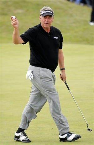 Northern Ireland's Darren Clarke reacts after putting on the 2nd hole during the final day of the British Open Golf Championship at Royal St George's golf course Sandwich, England, Sunday, July 17, 2011.
