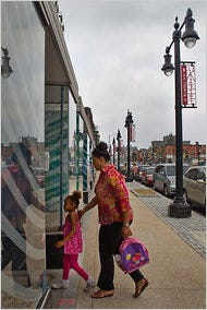 In the Northeast area of Washington, H Street shows signs of gentrification like new sidewalks and stylized street lamps.