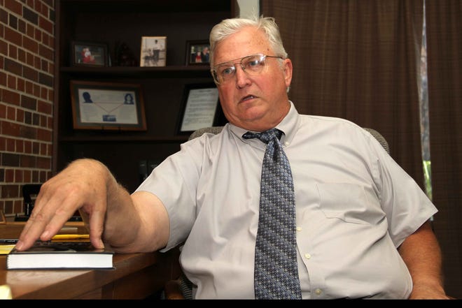 George “Bob” Dekle, former prosecutor of serial killer Ted Bundy, and now law school professor and author of “The Last Murder — The Investigation, Prosecution and Execution of Ted Bundy,” discusses the book in his office at the Fredric G. Levin College of Law at the University of Florida.