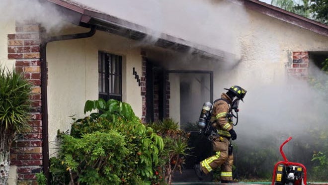 In the line of duty County fire-rescue responds to a Wellington house fire in May; no one was home, but two dogs were saved. Chief Steve Jerauld said the 'high-level, specialized training’ and risk required in this work justifies their compensation.
