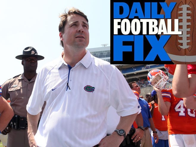 Florida head coach Will Muschamp gathers with the team following the Orange and Blue Debut on April 9.