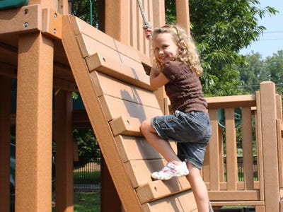 Selah, 5, enjoys the playground with her family and friends at Laurel Green in the town of Laurel Park.