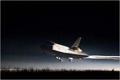 Space shuttle Atlantis lands at the Kennedy Space Center on Thursday.