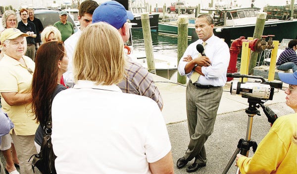 Gov. Deval Patrick answers questions at a public forum on Westport Point Thursday night. He said the next step in bringing rail service to the area is for state officials to make their case directly to EPA officials in Washington.