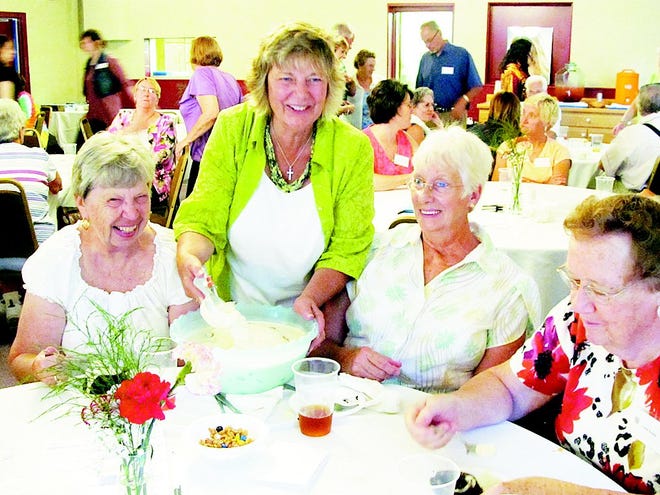 Carolyn Morrison dished out homemade ice cream to, from left, Lorraine Brooks, Mary Ann Wentworth and Carole Kahian.