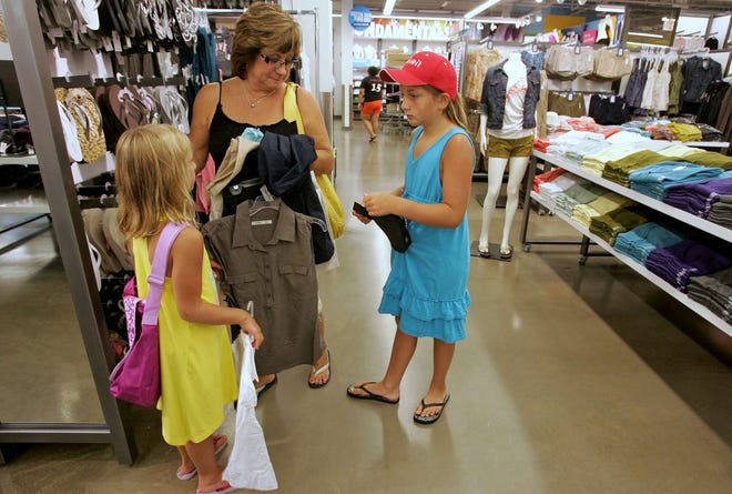 Linda Isaac shops with her granddaughters, Sydnee Gaudry (left) and Soleil Gaudry, at Old Navy on Thursday, July 21, 2011, in the Forest Plaza shopping center in Rockford.