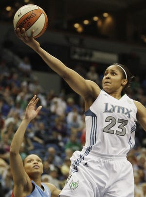 This June 17, 2011, file photo shows Minnesota Lynx forward Maya Moore going to the basket in the second half of a WNBA basketball game against the Atlanta Dream, in Minneapolis. Rookie Maya Moore has the top-selling jersey in the WNBA this season.