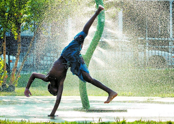 A sprinkler at Audrey Carey Park on Liberty Street in the City of Newburgh was a cool reason to do cartwheels Friday for Joshua King, 8. The Hudson Valley and the Northeastern United States have endured a heat wave for a week, with temperatures hovering around 100 degrees.