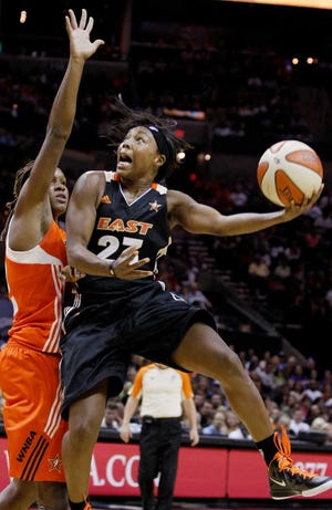 The East's Cappie Pondexter, right, shoots over the West's Rebekkah Brunson during the WNBA All-Star game on Saturday in San Antonio. Pondexter scored 17 in the East's 118-113 win.
