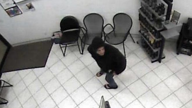 Surveillance camera photo of the suspect.