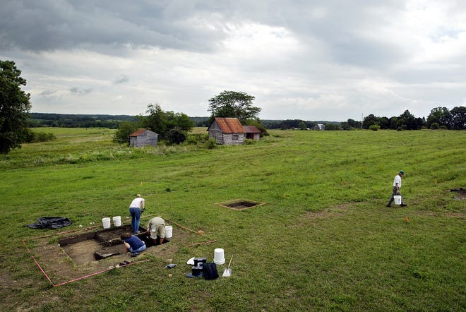 Archeologists work on the excavation of a home in the former town of New Philadelphia.