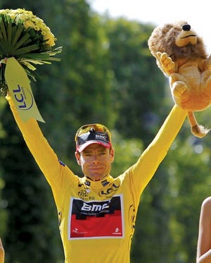 Tour de France winner Cadel Evans of Australia, wearing the
overall leader's yellow jersey, stands on the podium Sunday after
winning the Tour de France cycling race in Paris, France.