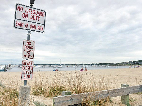 There will be no need to change signs at Monument Beach as a measure to spend $24,000 to pay for lifeguards this summer failed to get a two-thirds majority at special town meeting.