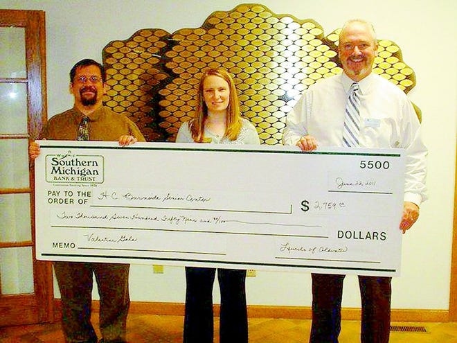 From left, are John Richardson, who works in social services at The Laurels, COA director Amy Duff and Laurels Administrator Curtis Covert, as a check for $2,759 from the event was given to the H&C Burnside Senior Center in June.