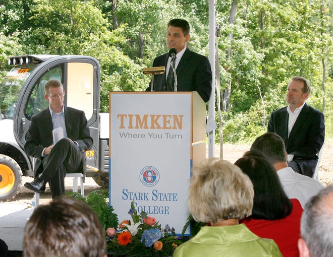 Tom Chiappini, Chief Operating Officer and Treasurer for Stark State College, speaks prior to turning over dirt on the new Stark State College and The Timken Company's Wind Energy Research and Development Center at Frank Road and Shuffel Drive in North Canton. From left are Doug Smith, Senior Vice President, Technology and Quality for The Timken Company; and Tim Timken, Chairman of the Board for the Timken Company.