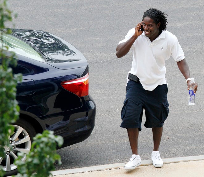 The Patriots' Deion Branch arrives at Gillette Stadium in Foxboro the day after the NFL lockout ended.