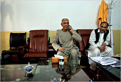 Ghulam Haider Hamidi, left, the mayor of Kandahar, in his office earlier this month. Mr. Hamidi was killed by a suicide bomber on Wednesday.