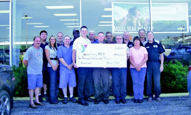 Shelly Trueblood/GateHouse News Service
Bruce Foote Chevrolet employees with Sales Manager Mike Tapper, Service Manager Robert Eldridge and Sam Brooks, Executive Director/CEO of the Warren County YMCA.