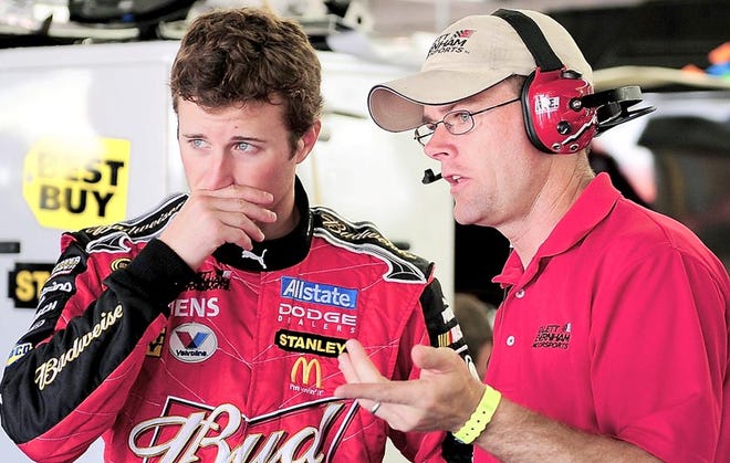 Jacksonville resident Kenny Francis (right) talks with driver Kasey Kahne.