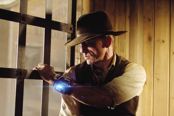 Zade Rosenthal, Universal Pictures/The Associated Press
Jake Lonergan (Daniel Craig) wanders into a New Mexico town with no clue to his identity and wearing a strange metal bracelet in "Cowboys & Aliens."