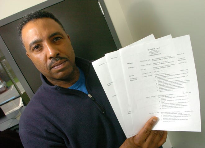 Russell Lopes of Brockton, who says he was passed over for a job at the Brockton DPW, shows a copy of his resume.