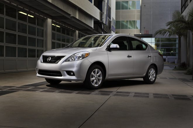 Todd Rossi, general manager at Mike Shad Nissan of Jacksonville on Cassat Avenue, is excited about the 2012 model year, which includes the totally redesigned Versa sedan (below right) and the all-electric LEAF (below left).