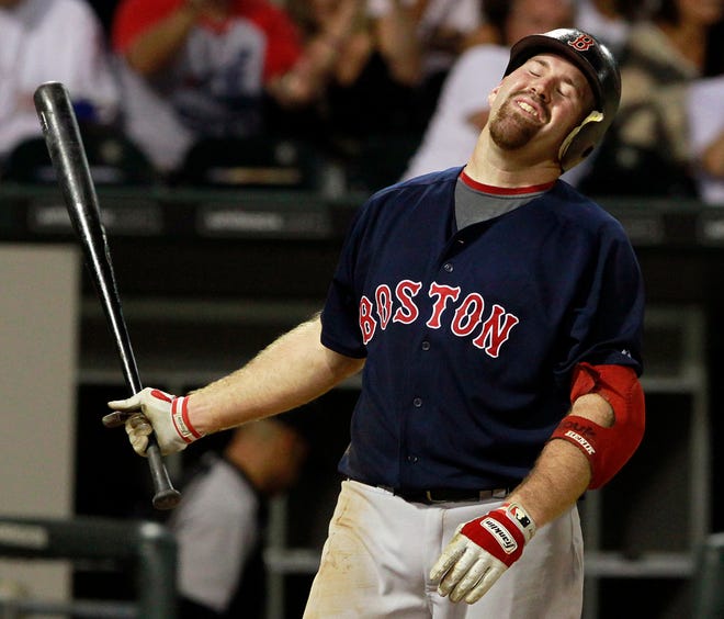Boston Red Sox's Kevin Youkilis reacts as he strikes out with the bases loaded against the Chicago White Sox in the sixth inning of a baseball game on Friday, July 29, 2011, in Chicago. (AP Photo/John Smierciak)