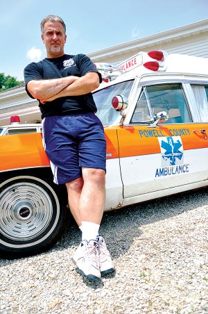 John Bisanz poses for a photograph with his 1969 Pontiac ambulance; it is only one of 139 models Pontiac ever made. GateHouse News Service