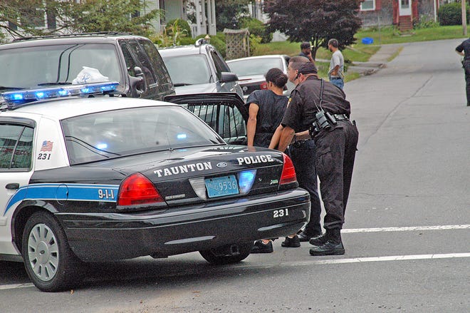 Police arrest a young man Friday afternoon at the intersection of Earl and Winthrop streets during an investigation of a report of a man displaying a handgun.