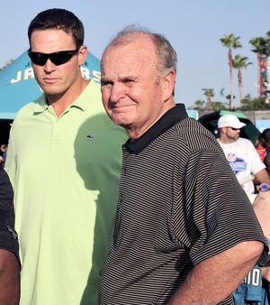 Jaguars owner Wayne Weaver (right) stands next to former player Tony Boselli on the opening day of training camp.