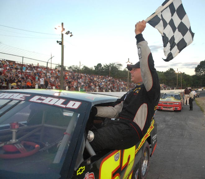 Al Stone III of New Haven waves the checkered flag following his victory in the Street Stock feature race at the Waterford Speedbowl Saturday, July 30, 2011. Saturday's win was Stone's 27th in the Street Stocks, the most career Street Stock victories at the Waterford Speedbowl.