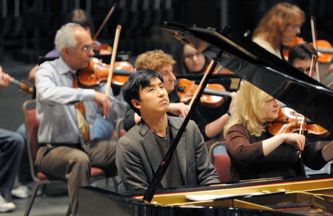 Guest pianist Julius Kim, shown rehearsing Brahms' First Piano Concerto with the Topeka Symphony Orchestra for its 2010-11 season closer, will return to close the 2011-12 season with Sibelius' Second Symphony on April 14.