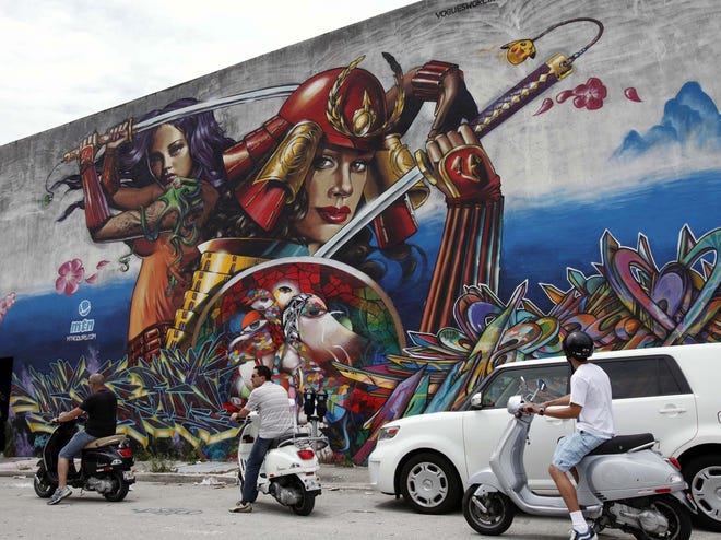 Roam Rides offers a two-hour graffiti tour on a Vespa in the Wynwood neighborhood of Miami. Once derided as vandalism, graffiti in the form of artistic murals has become an accepted art form. (AP Photo)