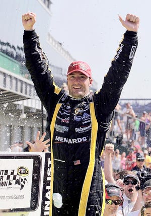 Paul Menard celebrates after winning the NASCAR Brickyard 400 Sunday at Indianapolis Motor Speedway. By DARRON CUMMINGS, The Associated Press