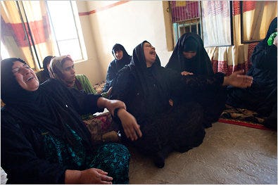 Khaula Ghazi, center, mourns the death of her brother whom villagers claim was killed during a joint Iraqi and U.S. raid.