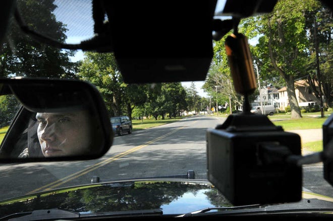 West Brookfield Police Officer Edwin F. Ward patrols West Brookfield on a recent afternoon. A camera hangs in the front window of his vehicle.