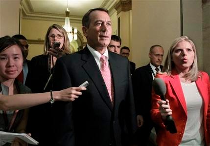 Speaker of the House John Boehner, R-Ohio, returns to his office after emergency legislation to avert a government default and cut federal spending passed a showdown vote in the House of Representatives, at the Capitol, in Washington, Monday, Aug. 1, 2011.