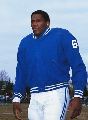 In this December 1967 file photo, Baltimore Colts defensive tackle Bubba Smith takes the field.