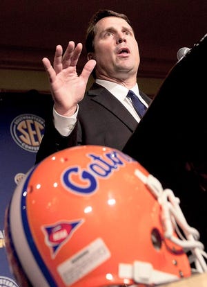 Florida coach Will Muschamp talks with reporters during Southeastern Conference Football Media Days July 20 in Hoover, Ala. File/AP Photo